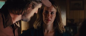 Movie still from “Mud” (2012), directed by Jeff Nichols – A woman looking at a man in a mirror; Close Up shot, Over the shoulder angle