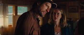 Movie still from “Mud” (2012), directed by Jeff Nichols – A man and a woman standing next to each other in a room; Close Up shot, Low angle