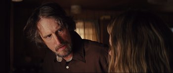 Movie still from “Mud” (2012), directed by Jeff Nichols – A man and a woman in a dark room; Close Up shot, Over the shoulder angle