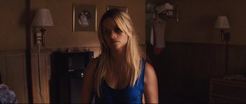 Movie still from “Mud” (2012), directed by Jeff Nichols – A woman with long blonde hair wearing a blue top; Close Up shot, Over the shoulder angle