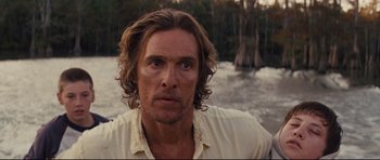 Movie still from “Mud” (2012), directed by Jeff Nichols – A person with long hair; Close Up shot, Over the shoulder angle