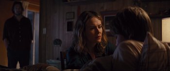 Movie still from “Mud” (2012), directed by Jeff Nichols – A woman sitting at a dinner table looking into the distance; Close Up shot, Over the shoulder angle