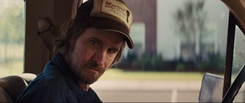Movie still from “Mud” (2012), directed by Jeff Nichols – A person wearing a hat; Close Up shot, Over the shoulder angle