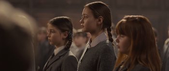 Movie still from “Never Let Me Go” (2010), directed by Mark Romanek – A group of young girls standing in a row; Close Up shot, Low angle
