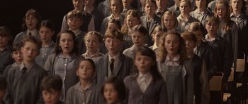 Movie still from “Never Let Me Go” (2010), directed by Mark Romanek – A large group of children in school uniforms; Medium shot, High angle