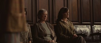 Movie still from “Never Let Me Go” (2010), directed by Mark Romanek – Two women sitting next to each other in a room; Medium shot, Over the shoulder angle