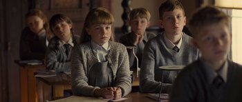 Movie still from “Never Let Me Go” (2010), directed by Mark Romanek – A group of young people sitting at a table; Medium shot, Over the shoulder angle