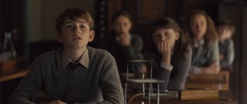 Movie still from “Never Let Me Go” (2010), directed by Mark Romanek – A group of people sitting at a table; Medium shot, Over the shoulder angle