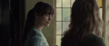 Movie still from “Never Let Me Go” (2010), directed by Mark Romanek – A young woman is looking into the distance; Close Up shot, Over the shoulder angle