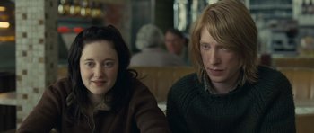 Movie still from “Never Let Me Go” (2010), directed by Mark Romanek – Two people sitting at a table in front of a window; Close Up shot, Over the shoulder angle