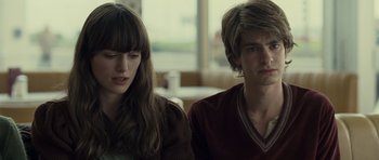 Movie still from “Never Let Me Go” (2010), directed by Mark Romanek – A man and a woman sitting next to each other in a room; Close Up shot, Over the shoulder angle