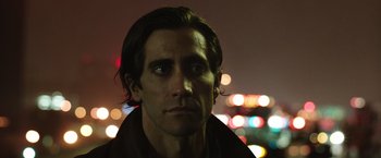 Movie still from “Nightcrawler” (2014), directed by Dan Gilroy – A person wearing a jacket; Close Up shot, Low angle