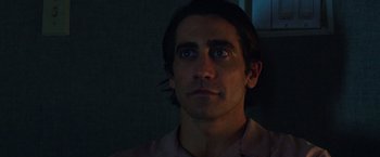 Movie still from “Nightcrawler” (2014), directed by Dan Gilroy – A person with long dark hair; Close Up shot, Low angle