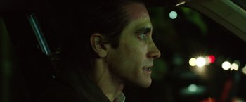 Movie still from “Nightcrawler” (2014), directed by Dan Gilroy – A person wearing a ear cuff; Close Up shot, Over the shoulder angle