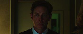 Movie still from “Nightcrawler” (2014), directed by Dan Gilroy – A person wearing a suit and tie; Close Up shot, Low angle