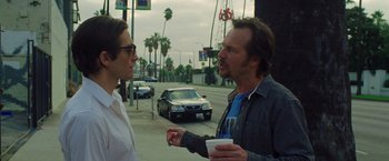 Movie still from “Nightcrawler” (2014), directed by Dan Gilroy – A man and a woman talking on the side of the road; Medium shot, Over the shoulder angle