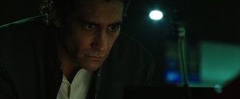 Movie still from “Nightcrawler” (2014), directed by Dan Gilroy – A person looking at the camera; Close Up shot, Low angle