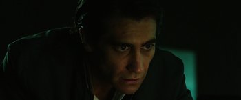 Movie still from “Nightcrawler” (2014), directed by Dan Gilroy – A person wearing a suit and tie; Close Up shot, Low angle