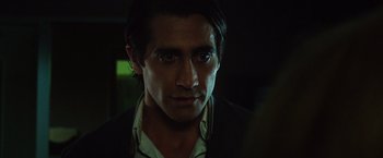 Movie still from “Nightcrawler” (2014), directed by Dan Gilroy – A person wearing a suit and tie; Close Up shot, Over the shoulder angle