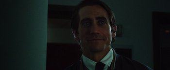 Movie still from “Nightcrawler” (2014), directed by Dan Gilroy – A person wearing a suit and tie; Close Up shot, Low angle