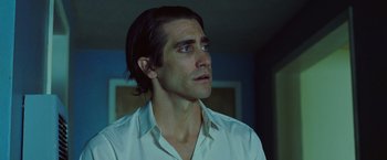 Movie still from “Nightcrawler” (2014), directed by Dan Gilroy – A man that is looking at something in the distance; Close Up shot, Low angle