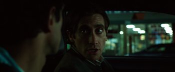 Movie still from “Nightcrawler” (2014), directed by Dan Gilroy – A person sitting in a car; Close Up shot, Over the shoulder angle