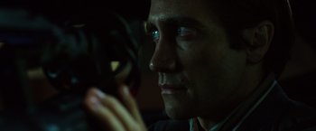 Movie still from “Nightcrawler” (2014), directed by Dan Gilroy – A person looking at a cell phone; Close Up shot, Over the shoulder angle