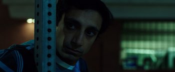 Movie still from “Nightcrawler” (2014), directed by Dan Gilroy – A person looking at the camera; Close Up shot, Low angle