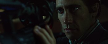 Movie still from “Nightcrawler” (2014), directed by Dan Gilroy – A person holding a camera; Close Up shot, Low angle