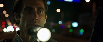 Movie still from “Nightcrawler” (2014), directed by Dan Gilroy – A person with a flashlight; Close Up shot, Low angle