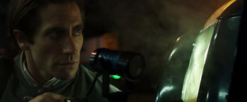 Movie still from “Nightcrawler” (2014), directed by Dan Gilroy – A man is holding a video camera in his hand; Close Up shot, Over the shoulder angle