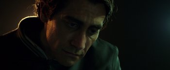 Movie still from “Nightcrawler” (2014), directed by Dan Gilroy – A man's face in the dark; Close Up shot, Low angle