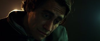Movie still from “Nightcrawler” (2014), directed by Dan Gilroy – A man's face in the dark; Close Up shot, Low angle