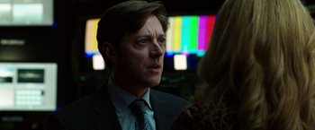 Movie still from “Nightcrawler” (2014), directed by Dan Gilroy – A person wearing a suit and a tie; Close Up shot, Over the shoulder angle