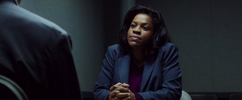 Movie still from “Nightcrawler” (2014), directed by Dan Gilroy – A woman sitting in front of a mirror with her hands crossed; Close Up shot, Over the shoulder angle