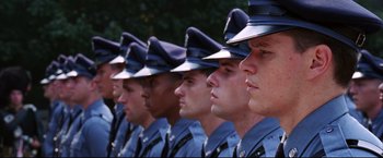 Movie still from “The Departed” (2006), directed by Martin Scorsese – A row of police officers lined up side by side; Close Up shot, Low angle
