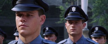 Movie still from “The Departed” (2006), directed by Martin Scorsese – A group of men in police uniforms standing next to each other; Close Up shot, Low angle