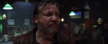 Movie still from “The Departed” (2006), directed by Martin Scorsese – A person with a beard; Close Up shot, Low angle