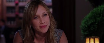 Movie still from “The Departed” (2006), directed by Martin Scorsese – A person sitting in front of a window; Close Up shot, Over the shoulder angle