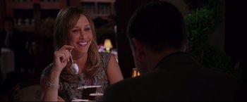 Movie still from “The Departed” (2006), directed by Martin Scorsese – A woman sitting at a table with a man; Medium shot, Over the shoulder angle