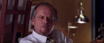 Movie still from “The Departed” (2006), directed by Martin Scorsese – An older man wearing a white dress shirt and a tie; Close Up shot, Low angle