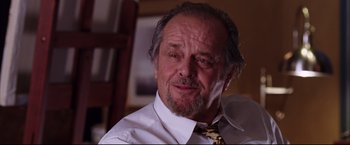 Movie still from “The Departed” (2006), directed by Martin Scorsese – An older man wearing a white dress shirt and a tie; Close Up shot, Low angle