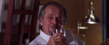 Movie still from “The Departed” (2006), directed by Martin Scorsese – An older man drinking a glass of beer; Close Up shot, Low angle