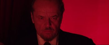 Movie still from “The Departed” (2006), directed by Martin Scorsese – A man with a beard and a suit and tie; Close Up shot, Low angle