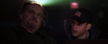 Movie still from “The Departed” (2006), directed by Martin Scorsese – A man and a woman sitting next to each other in the dark; Close Up shot, Over the shoulder angle
