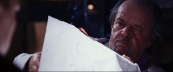 Movie still from “The Departed” (2006), directed by Martin Scorsese – An older man sitting in front of a white wall; Close Up shot, Over the shoulder angle