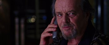 Movie still from “The Departed” (2006), directed by Martin Scorsese – An older man talking on a cell phone; Close Up shot, Low angle