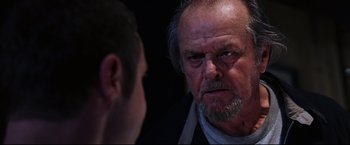 Movie still from “The Departed” (2006), directed by Martin Scorsese – An older man stares at a younger man in a dark room; Close Up shot, Over the shoulder angle