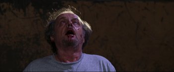 Movie still from “The Departed” (2006), directed by Martin Scorsese – A person with blood on his face; Close Up shot, Low angle