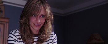 Movie still from “The Departed” (2006), directed by Martin Scorsese – A person with long blonde hair; Close Up shot, Over the shoulder angle